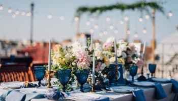 Long,Dinner,Tables,Covered,With,Grey,And,Blue,Cloth,,Served