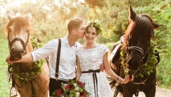 Bride,And,Groom,In,Forest,With,Horses.,Wedding,Couple,With